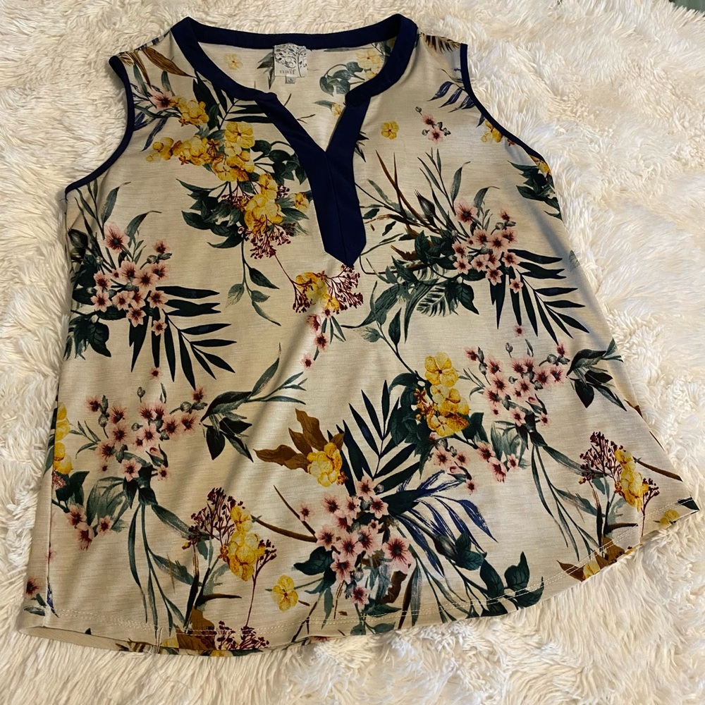Naif- sleeveless, floral top. Large